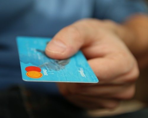 mans-hand-with-credit-card